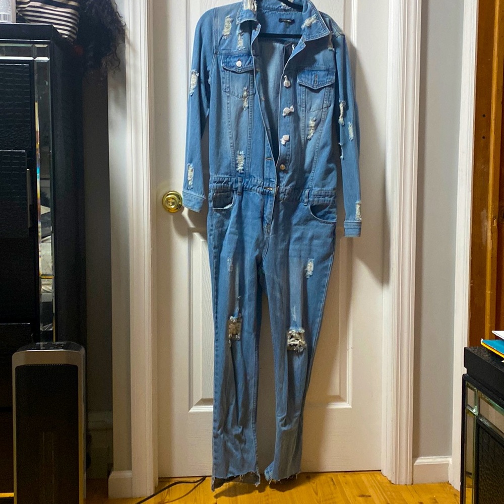 Authentic Denim jumpsuit with rips, not much stretch, true to size